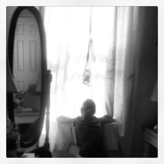 I took this photo of my daughter. She looked so sad. It seems fitting...